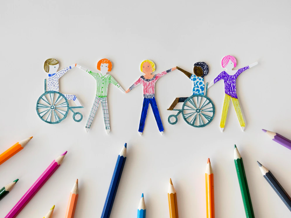 multi-ethnic-disabled-people-community-with-pencils_23-2148699762